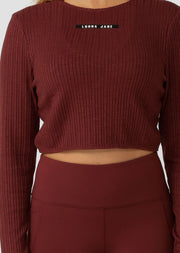 Elevate your studio practice wardrobe with our long sleeve twist back rib crop top. Made with a premium cotton blend rib fabric, it provides style and flexibility during any yoga or Pilates session. Wear it back with a matching set, or throw on this stylish piece as a light layer for your walks & weekends.