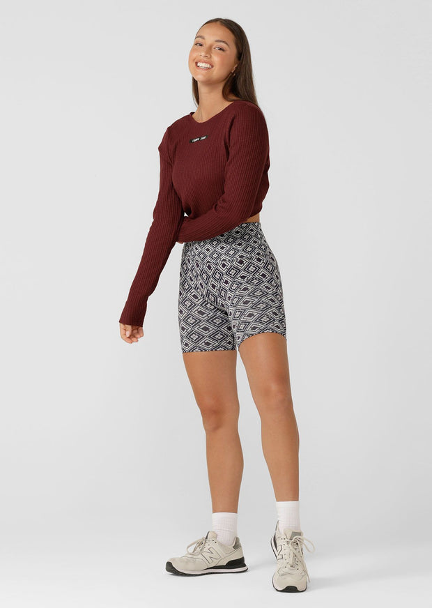 Elevate your studio practice wardrobe with our long sleeve twist back rib crop top. Made with a premium cotton blend rib fabric, it provides style and flexibility during any yoga or Pilates session. Wear it back with a matching set, or throw on this stylish piece as a light layer for your walks & weekends.