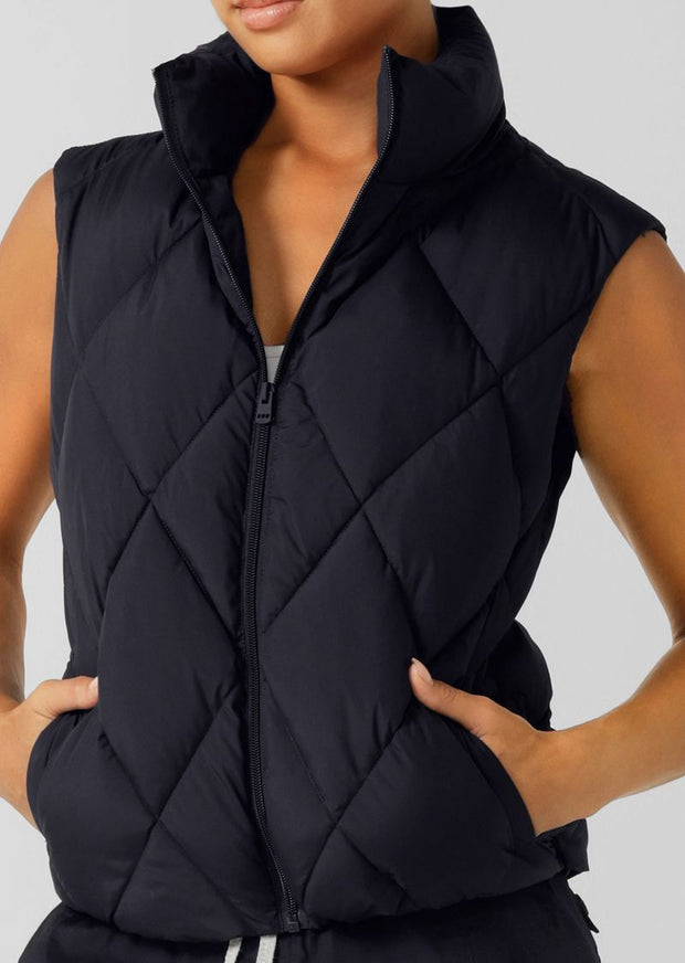 Keep out the chill with the Winter Warmth Puffer Vest. This warm winter staple has  plant-based Sorona® filling (which is warmer than standard polyester fill). It features an easy zip through opening and hidden toggles to cinch your hem and trap in the warmth. This is the perfect zip-and-go addition to your active and leisure outfits! 
