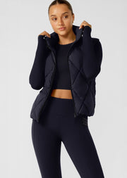Keep out the chill with the Winter Warmth Puffer Vest. This warm winter staple has  plant-based Sorona® filling (which is warmer than standard polyester fill). It features an easy zip through opening and hidden toggles to cinch your hem and trap in the warmth. This is the perfect zip-and-go addition to your active and leisure outfits! 