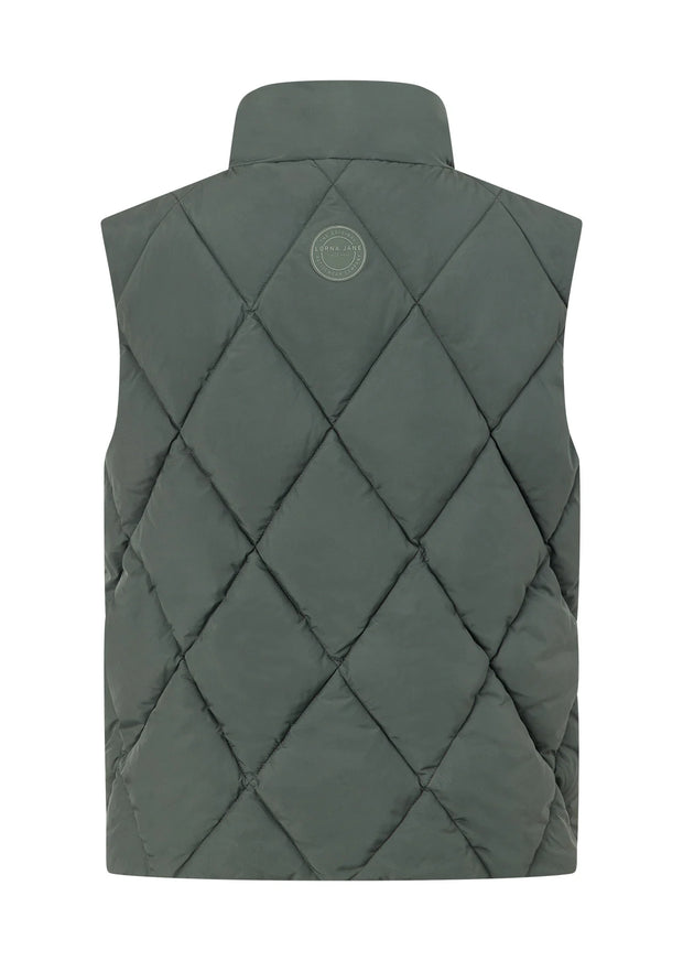 Stay warm in style with the Winter Warmth Reversible Puffer Vest. This warm winter staple features plant-based Sorona® filling (which is warmer than standard polyester fill) and can be worn 2 ways- with and without quilting. With zip side pockets for your essentials and hidden toggles to cinch your hem and trap in the warmth, this is the perfect zip-and-go addition to your active and leisure outfits!