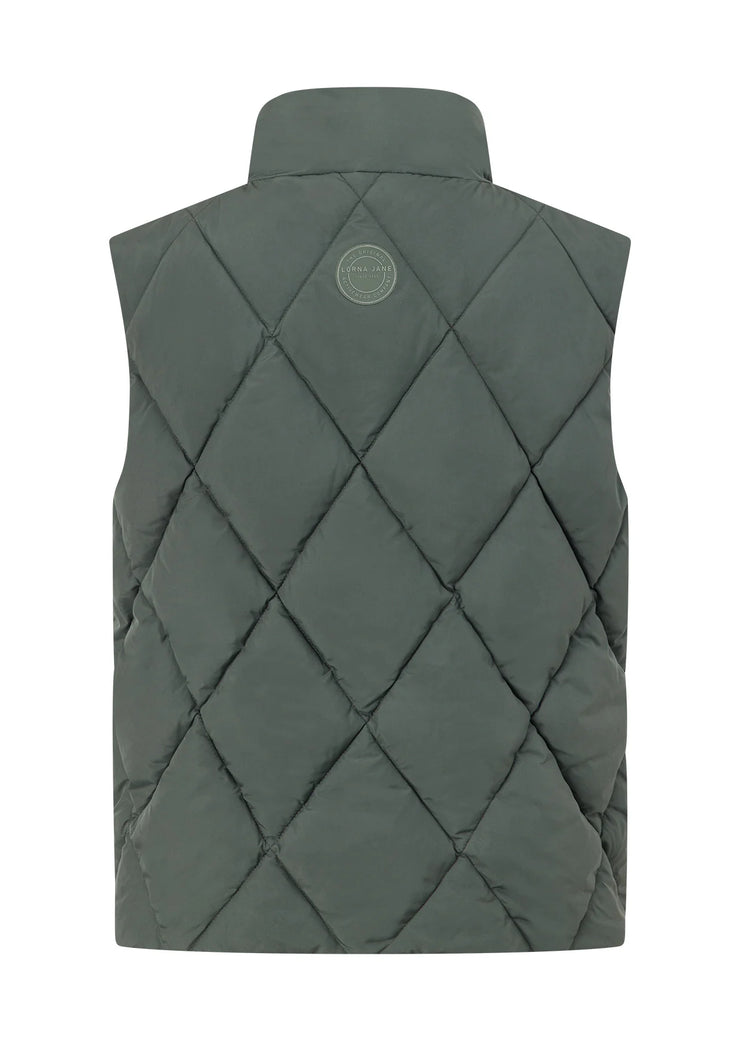Stay warm in style with the Winter Warmth Reversible Puffer Vest. This warm winter staple features plant-based Sorona® filling (which is warmer than standard polyester fill) and can be worn 2 ways- with and without quilting. With zip side pockets for your essentials and hidden toggles to cinch your hem and trap in the warmth, this is the perfect zip-and-go addition to your active and leisure outfits!