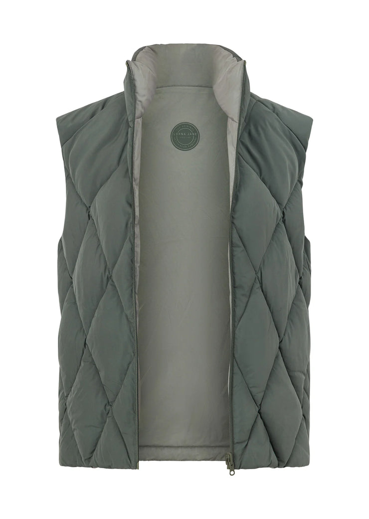 Stay warm in style with the Winter Warmth Reversible Puffer Vest. This warm winter staple features plant-based Sorona® filling (which is warmer than standard polyester fill) and can be worn 2 ways- with and without quilting. With zip side pockets for your essentials and hidden toggles to cinch your hem and trap in the warmth, this is the perfect zip-and-go addition to your active and leisure outfits!