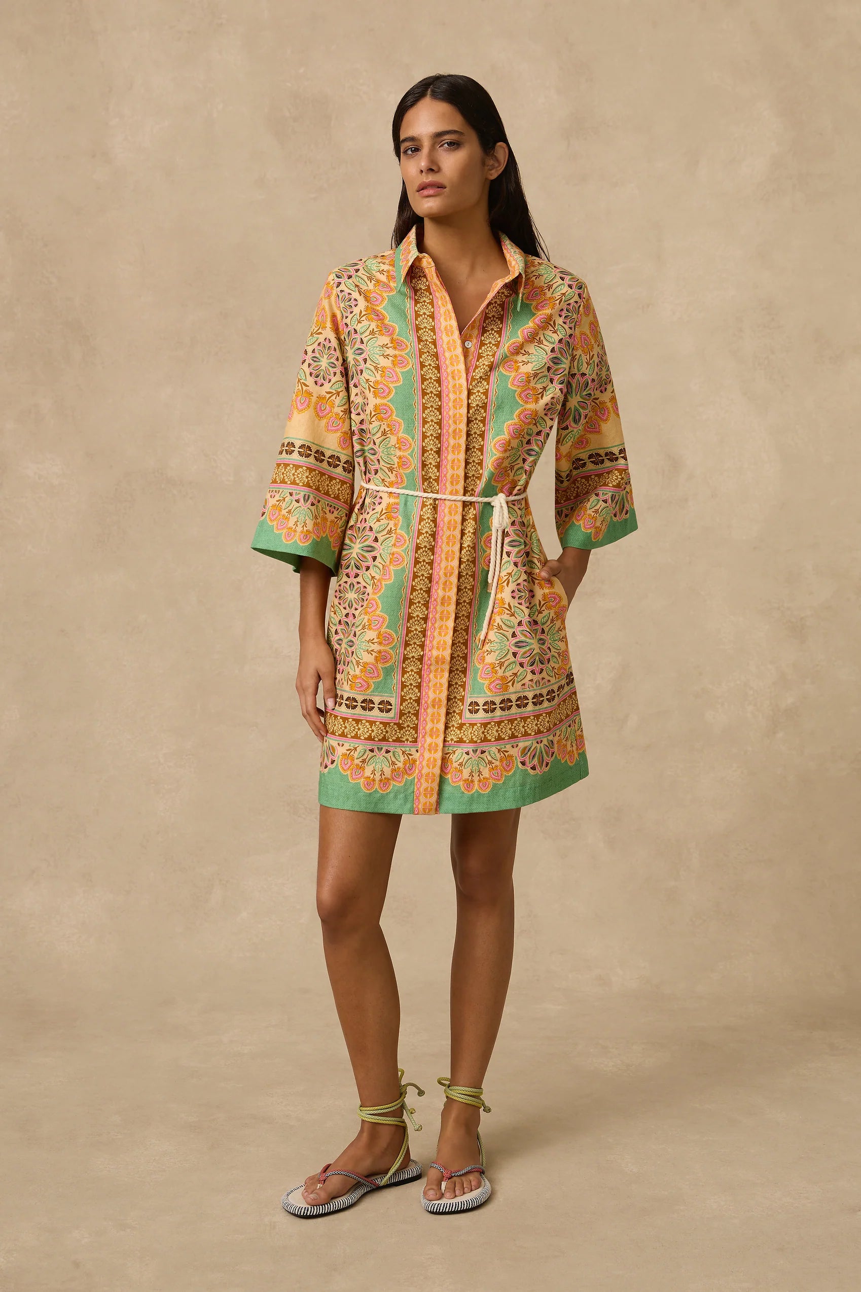 The Selma Shirt Dress is a linen mini shirt dress with a concealed front placket opening, classic collar, 3/4 length loose sleeves, placement print throughout and removable rope tie belt.