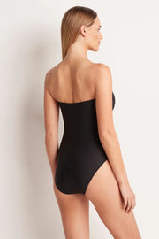 The ML Separates Ruched Bandeau One Piece is a best-selling bandeau one piece featuring flattering gathering across the front and secret support with a power mesh layer through the front and gripper tape around the upper bust. 