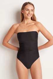 The ML Separates Ruched Bandeau One Piece is a best-selling bandeau one piece featuring flattering gathering across the front and secret support with a power mesh layer through the front and gripper tape around the upper bust. 