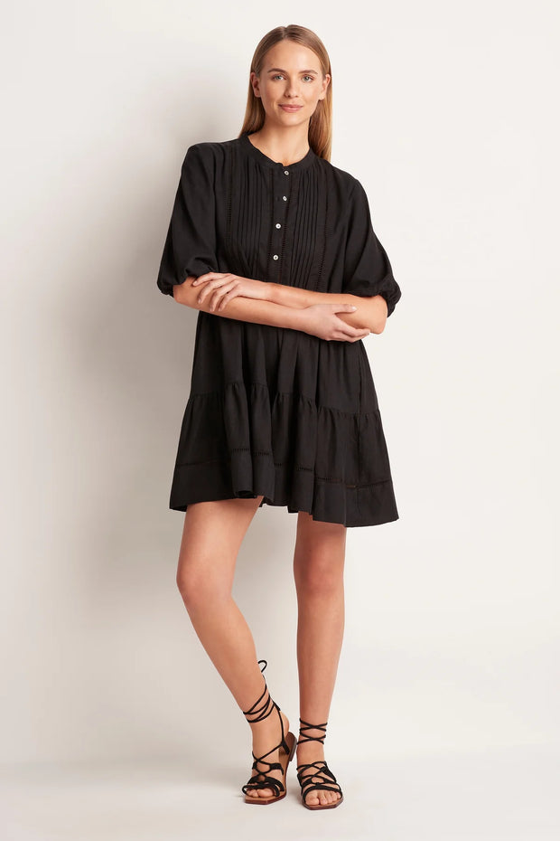 The ML Separates Tiered Mini Dress is designed for comfort and perfect for any holiday wardrobe.   Button front opening with pintuck detail and ladder inserts. Comfortable loose fit  Mid thigh length Side pockets Short blouson sleeve with elastic hem Dress length from Shoulder to hem on a size small is 90cm.