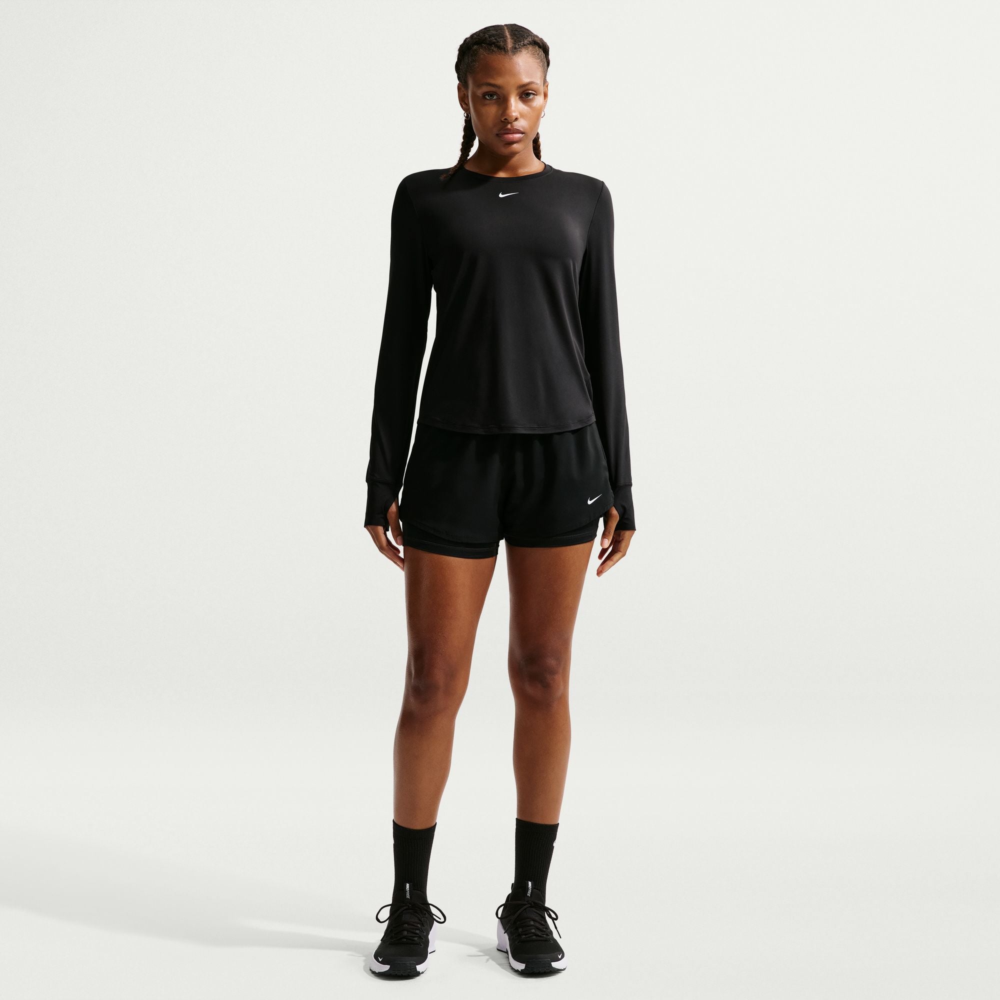A crew neckline adds a classic, timeless vibe to the top. The curved hem and elegant seam lines throughout the design keep the look sleek, so you can wear it as the first layer—or the only layer.