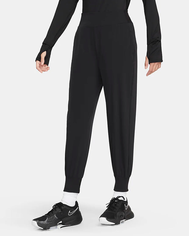 Find your bliss in these lightweight, moisture-wicking pants. The wide, stretchy waistband offers support while sleek, featherlight fabric–with plenty of stretch–flows with you so you can move without boundaries. Tapered legs with ribbed cuffs help keep these relaxed joggers in place no matter how you move.