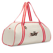 This bag keeps everything you need for your class, workout or adventure one zip away. It has a spacious main compartment and zippered pockets inside and out for quick-grab organization. Carry it by hand or over your shoulder so your gear is always close. This product is made with at least 65% recycled polyester fibers.