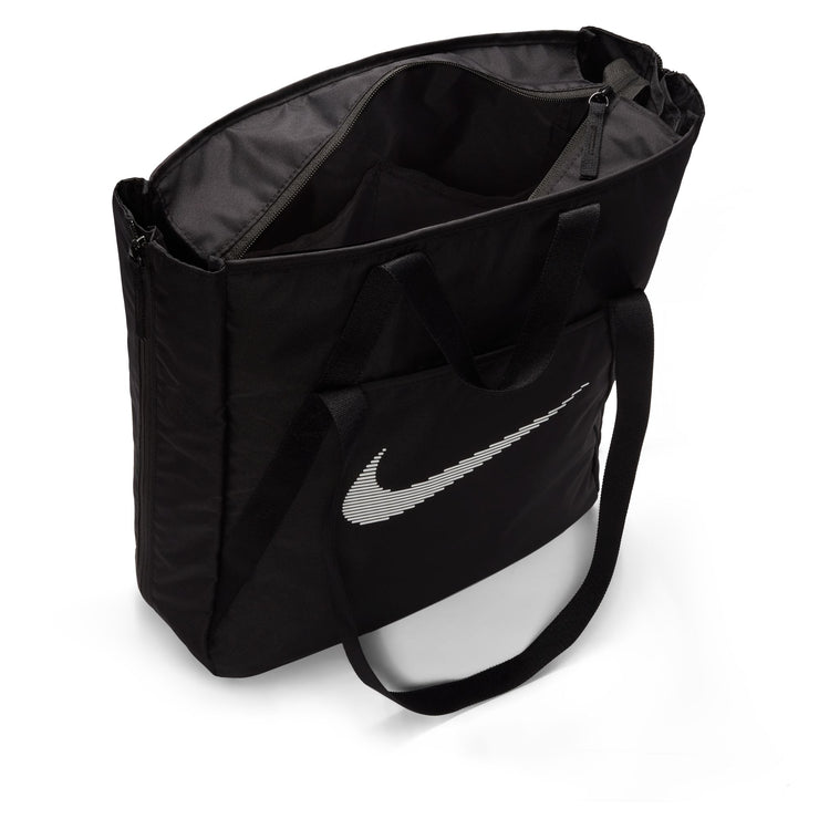 This tote bag is as multidimensional as you are. No matter what your fitness journey is, the Nike Gym Tote is made to handle it. Multiple deep pockets line the inside of this bag, both open and zippered for extra security. The front and back features pockets for the small things you want easy access to. And, the size of this tote is deceptive—the sides feature expanding fabric panels for extra space whenever you need it.