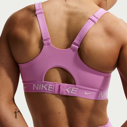 Magenta Nike high support sports bra on a person against a neutral background