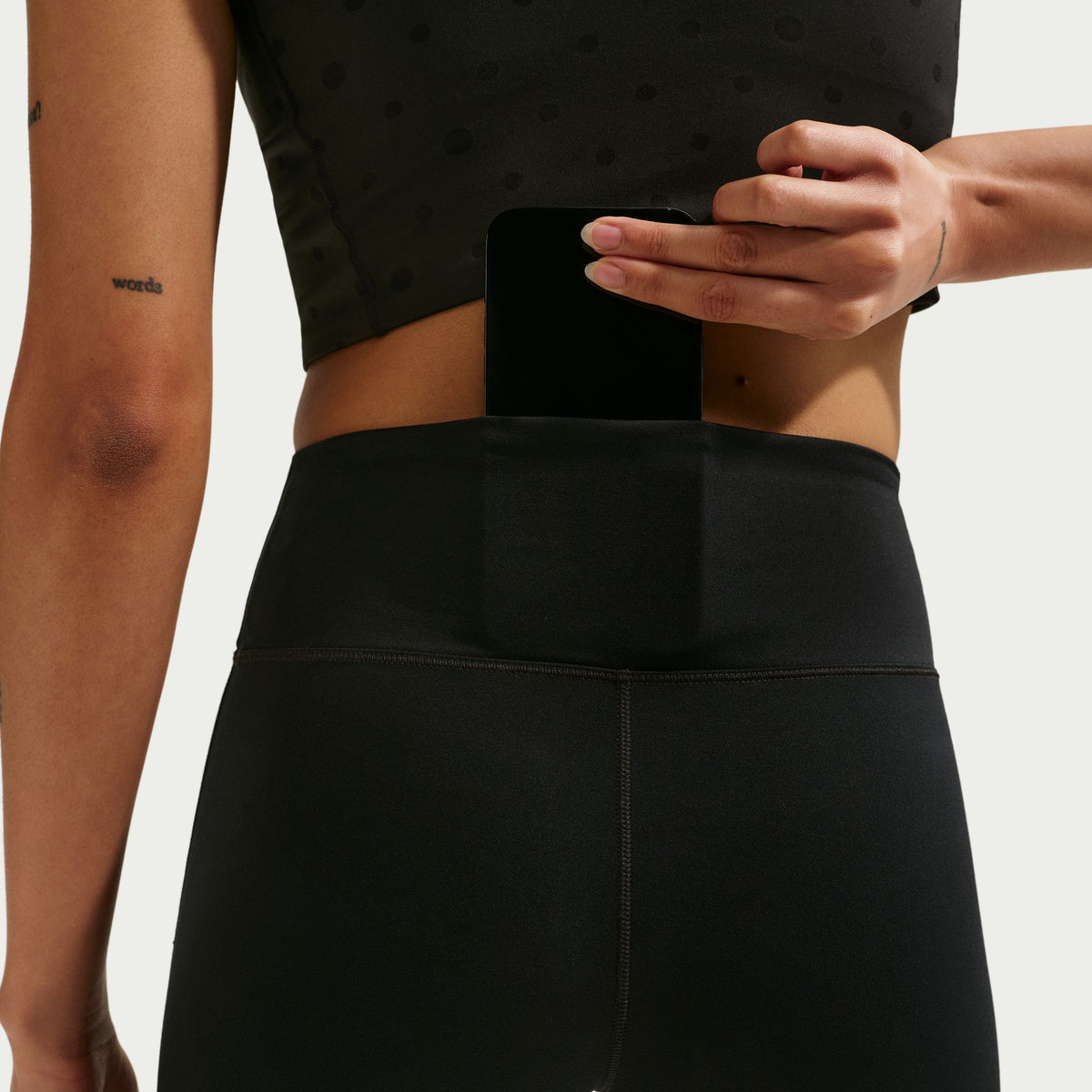 Nike Dri-FIT technology moves sweat away from your skin for quicker evaporation, helping you stay dry and comfortable.
Midweight, peachy-soft fabric stretches with your every move and dries quickly.
Absence of a front seam helps keep the fabric from riding up for a smooth fit.
Back pocket fits most phones.