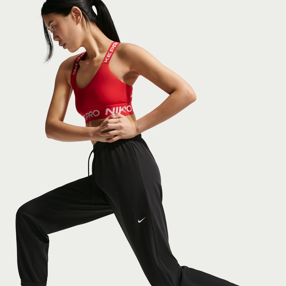 Nike Dri-FIT technology moves sweat away from your skin for quicker evaporation, helping you stay dry and comfortable.
Encased elastic waistband with drawcord secures your fit.
Hidden snaps at the pant cuffs offer an easy on and off experience.