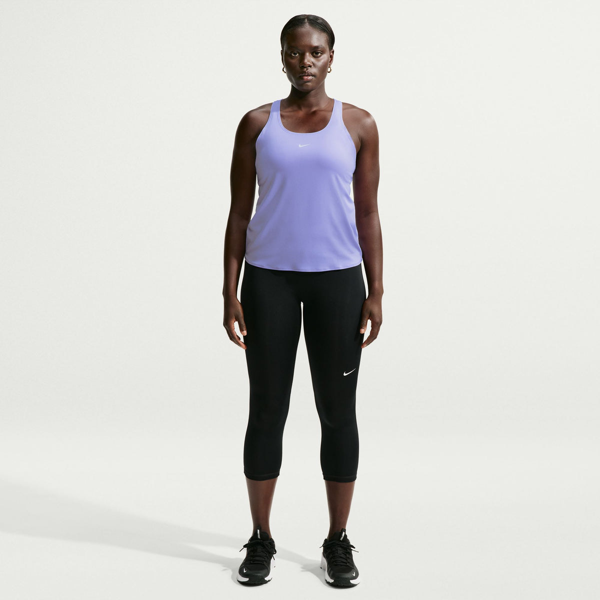 Ready to sweat? This tank's ultralightweight, silky-smooth fabric dries quickly to help you stay cool when your workout heats up. An open back allows moisture to escape.
