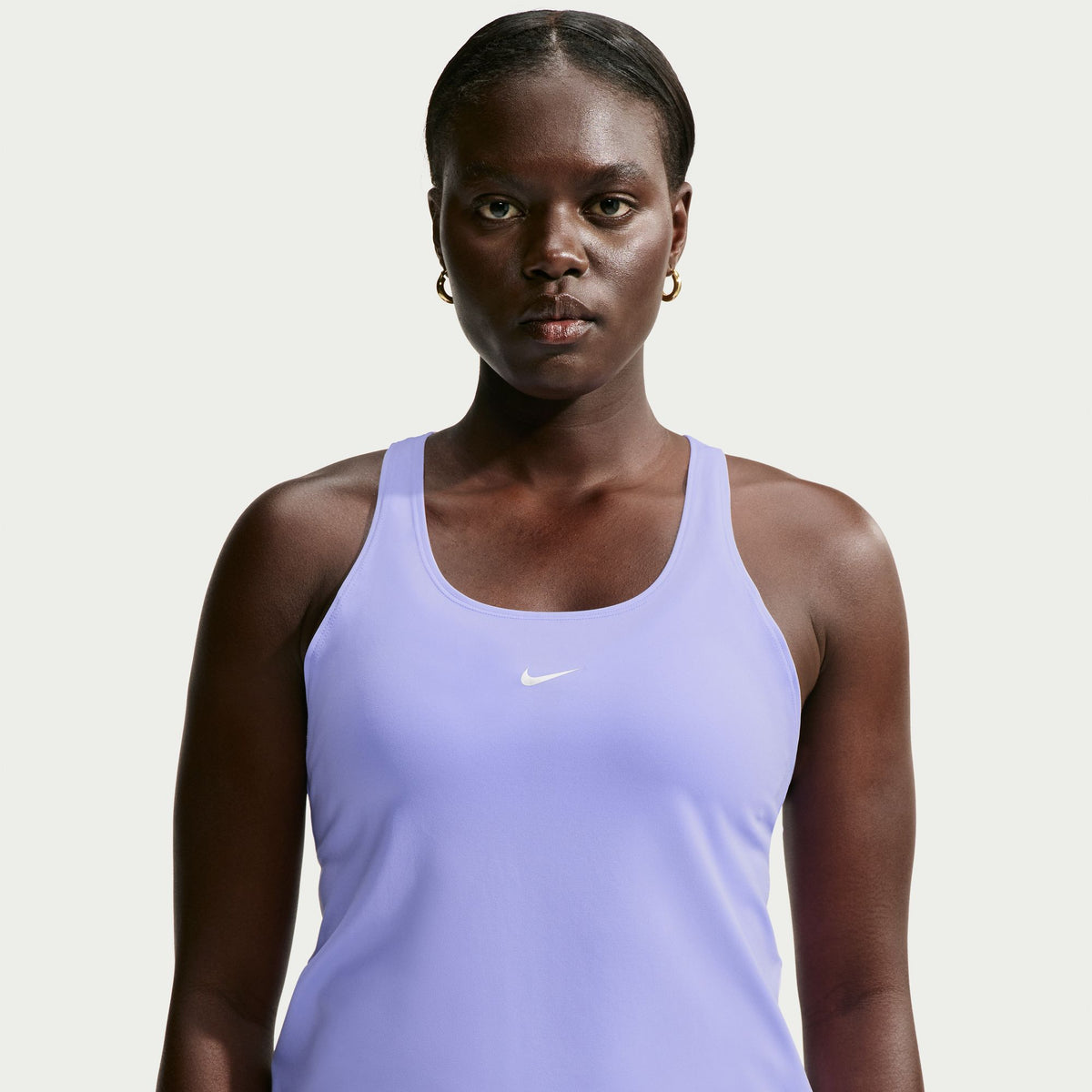Ready to sweat? This tank's ultralightweight, silky-smooth fabric dries quickly to help you stay cool when your workout heats up. An open back allows moisture to escape.
