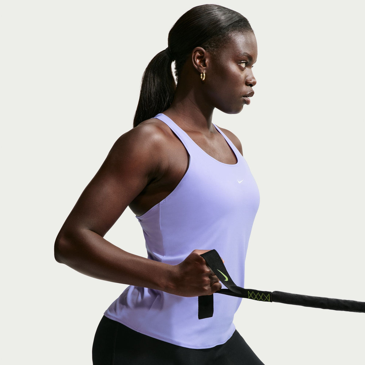 Ready to sweat? This tank's ultralightweight, silky-smooth fabric dries quickly to help you stay cool when your workout heats up. An open back allows moisture to escape.
