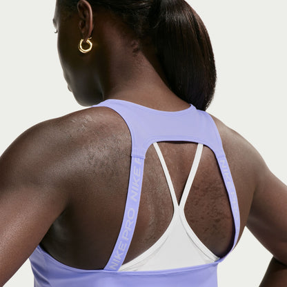 Ready to sweat? This tank's ultralightweight, silky-smooth fabric dries quickly to help you stay cool when your workout heats up. An open back allows moisture to escape.

