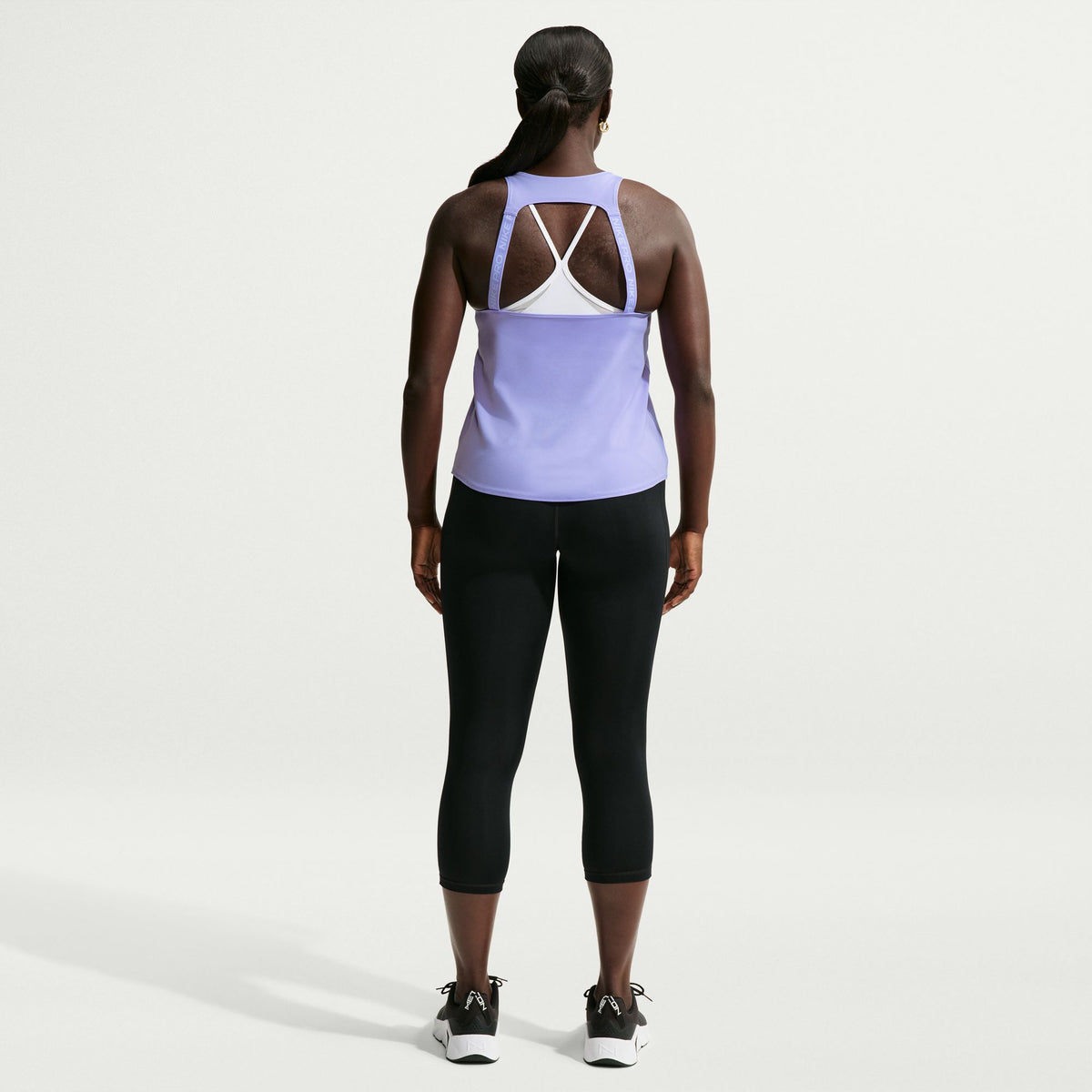 Ready to sweat? This tank's ultralightweight, silky-smooth fabric dries quickly to help you stay cool when your workout heats up. An open back allows moisture to escape.
