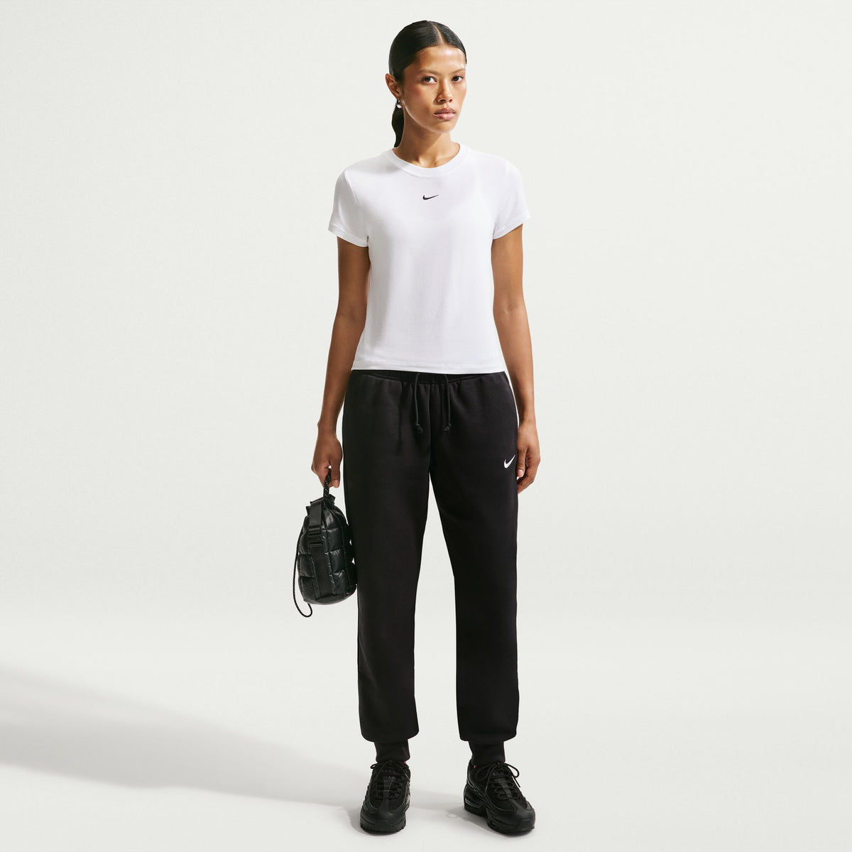 Perfect for any day, this slightly cropped, slim-fitting tee is classic and versatile. Nike's smooth jersey feels stretchy with a slight drape, giving it a comfortable, body-skimming feel.