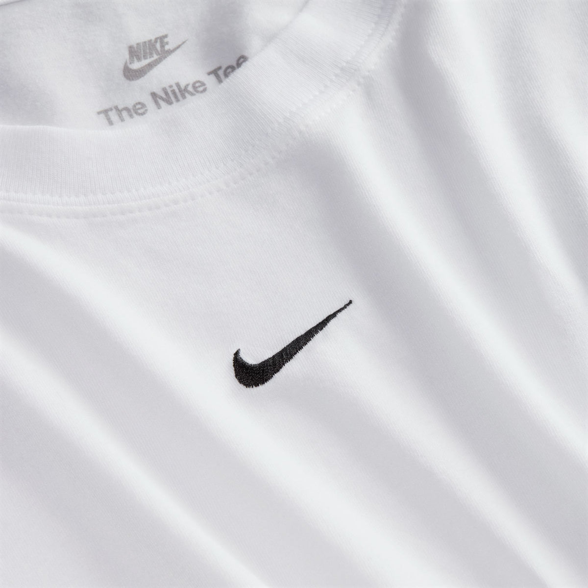 Perfect for any day, this slightly cropped, slim-fitting tee is classic and versatile. Nike's smooth jersey feels stretchy with a slight drape, giving it a comfortable, body-skimming feel.