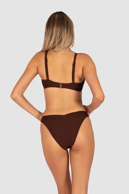 Positano's premium Spanish soft rib brings elevated, resort-ready sophistication to this underwire bra top — confident, sculpting support for D–E cups with a gold luxe trim that elevates every silhouette.
