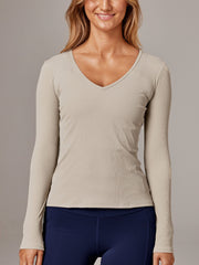 Stay on point in the beautiful 'ballet' long sleeve workout tee. Crafted from RB's premium silken Italian Bisou rib, the slim-fit long sleeve top, features a v neckline and sits just at the lap length creating the perfect tuckable silhouette. The perfect activewear tee to take you to and from your studio & yoga workout.