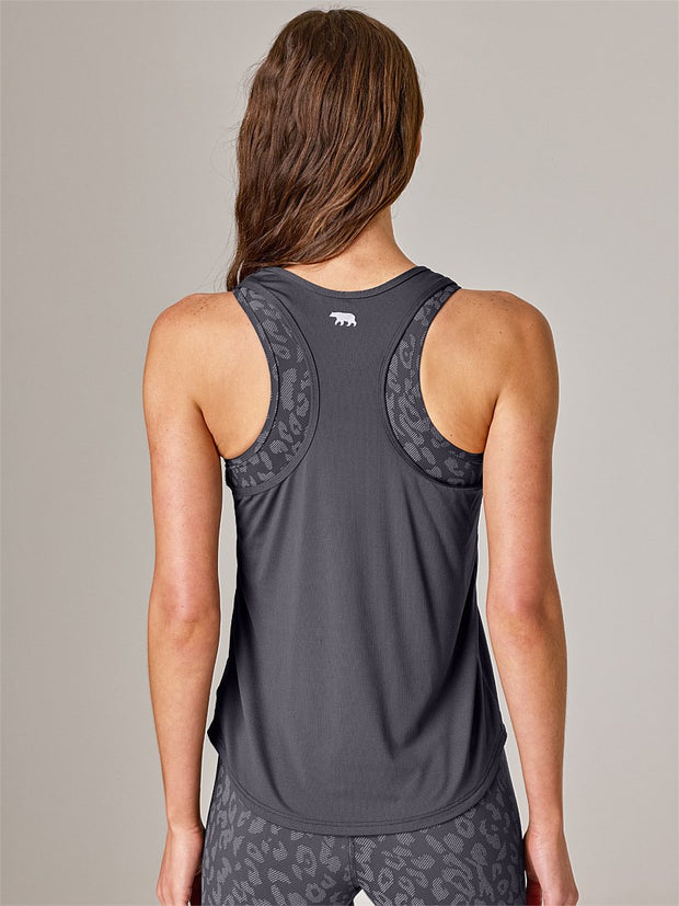 Featuring the world’s first dual action cooling technology, the Running Bare runCOOL Workout Tank combines Swiss technology HEIQ COOL TM – DUAL ACTION COOLING  for instant & continuous cooling. RB runCOOL will cool the body before the first sign of sweat & continually regulates the body temperature to enhance a cool, dry and comfortable climate, making it ideal for running and high intensity workouts.