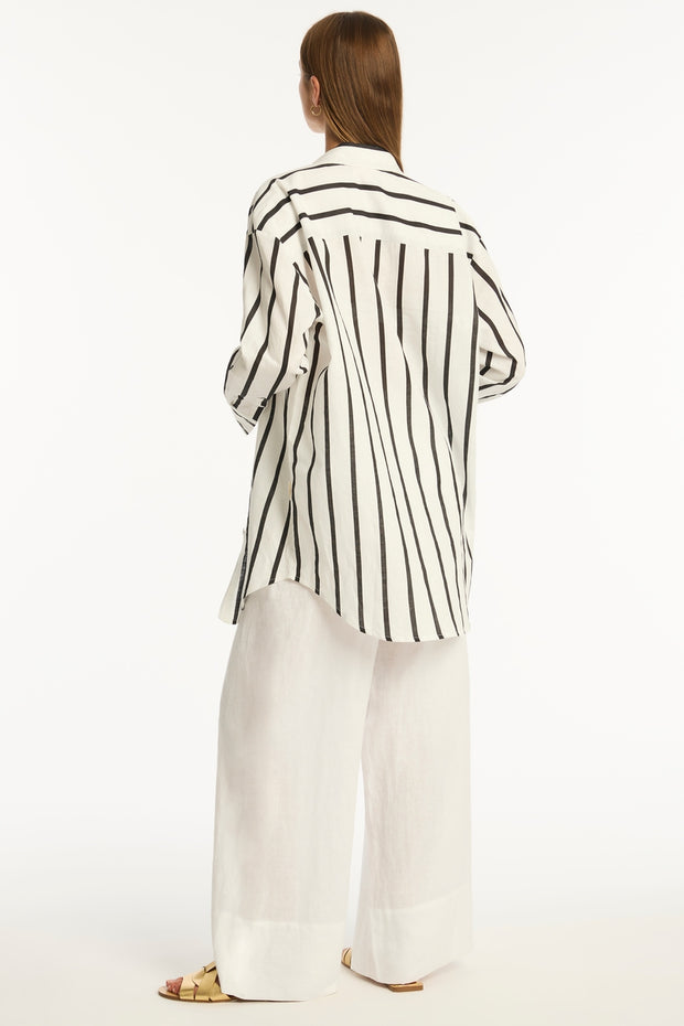 The Corfu Stripe Shirt is crafted from a super soft, lightweight linen fabrication f<span data-mce-fragment="1">eaturing a stripe design, this over shirt adds a touch of understated sophistication to your look</span>.&nbsp;The&nbsp;<span data-mce-fragment="1">loose, oversized fit offers a generous silhouette, making it the ideal piece to throw over your swimwear for a chic beach or poolside look.</span>