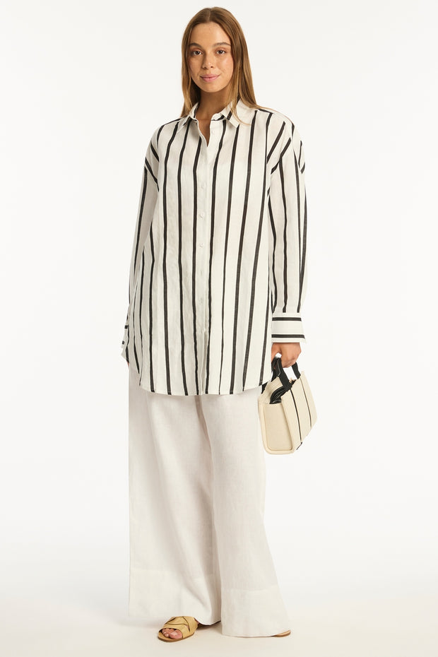The Corfu Stripe Shirt is crafted from a super soft, lightweight linen fabrication f<span data-mce-fragment="1">eaturing a stripe design, this over shirt adds a touch of understated sophistication to your look</span>.&nbsp;The&nbsp;<span data-mce-fragment="1">loose, oversized fit offers a generous silhouette, making it the ideal piece to throw over your swimwear for a chic beach or poolside look.</span>