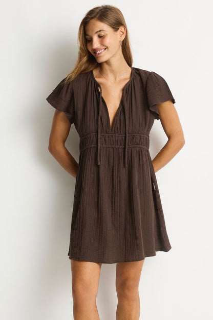 Cotton cheesecloth fabric
Soft touch fabric
V front neckline with tie
Elastic underbust panel
Short fluted sleeve