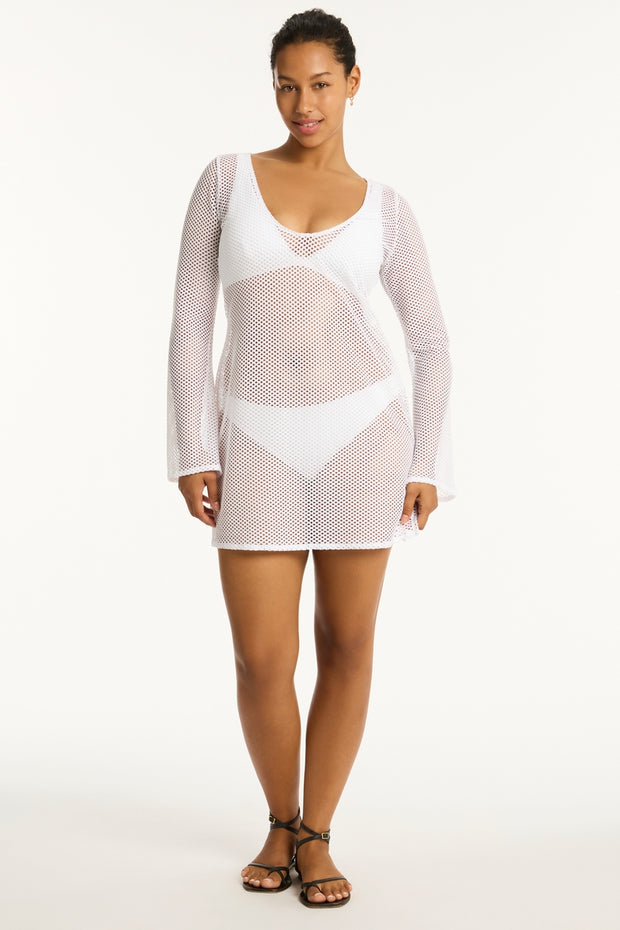 Premium lightweight stretch mesh that can be worn during the day over your swimsuit or at night with a slip. A reversible neckline gives you the option of a high or scooped look. Long sleeves.  Side splits. 