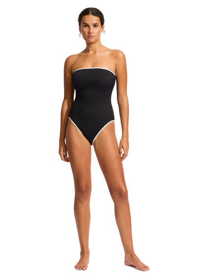 The DD Bandeau One Piece features an internal shelf bra, hidden underwire, gripper tape, removable & adjustable straps, high legline, contrast bin