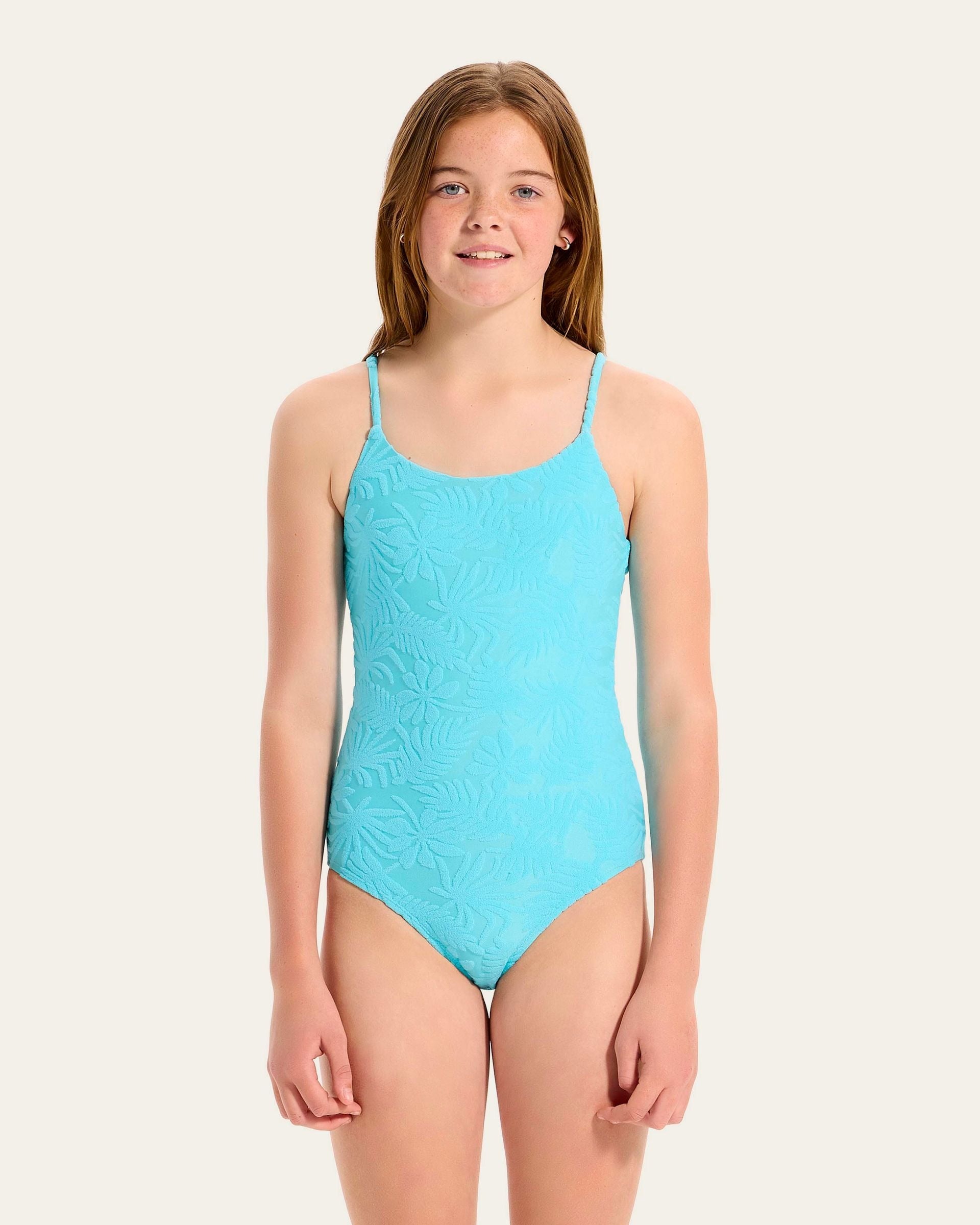 Seafolly Girls Terry One Piece features a round neckline, adjustable straps, textured, embossed terry fabrication and is fully lined for modesty.