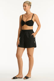 High waisted, mid length short Elastic and pull cord waist tie Side pockets