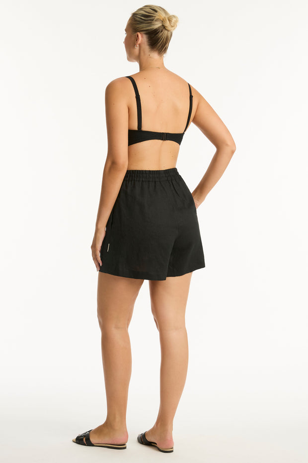 High waisted, mid length short Elastic and pull cord waist tie Side pockets