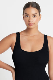  Conservative scoop one piece - Mid, scoop back - Twin needle finish - stays in place where you put it - Wide shoulder straps for support - Adjustable coverage - can be worn mid to full - Adjustable leg - can be worn high or low on the hip - Stretches over small to large bust sizes