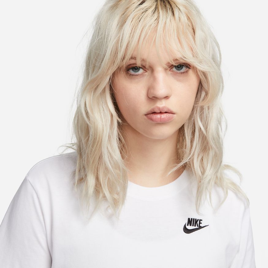 Nike Sportswear Club Essentials Women's T-Shirt Nike updated their Club Essentials T-shirts to give them an easy fit and modern look perfect for everyday wear. A little wider, a touch shorter in the body and a slightly curved hem give this always-comfortable top its updated look.